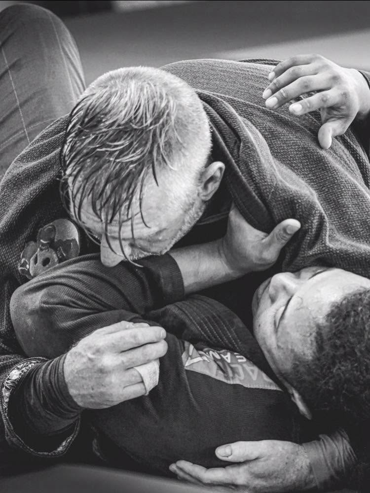Close-up of two practitioners working on grappling technique
